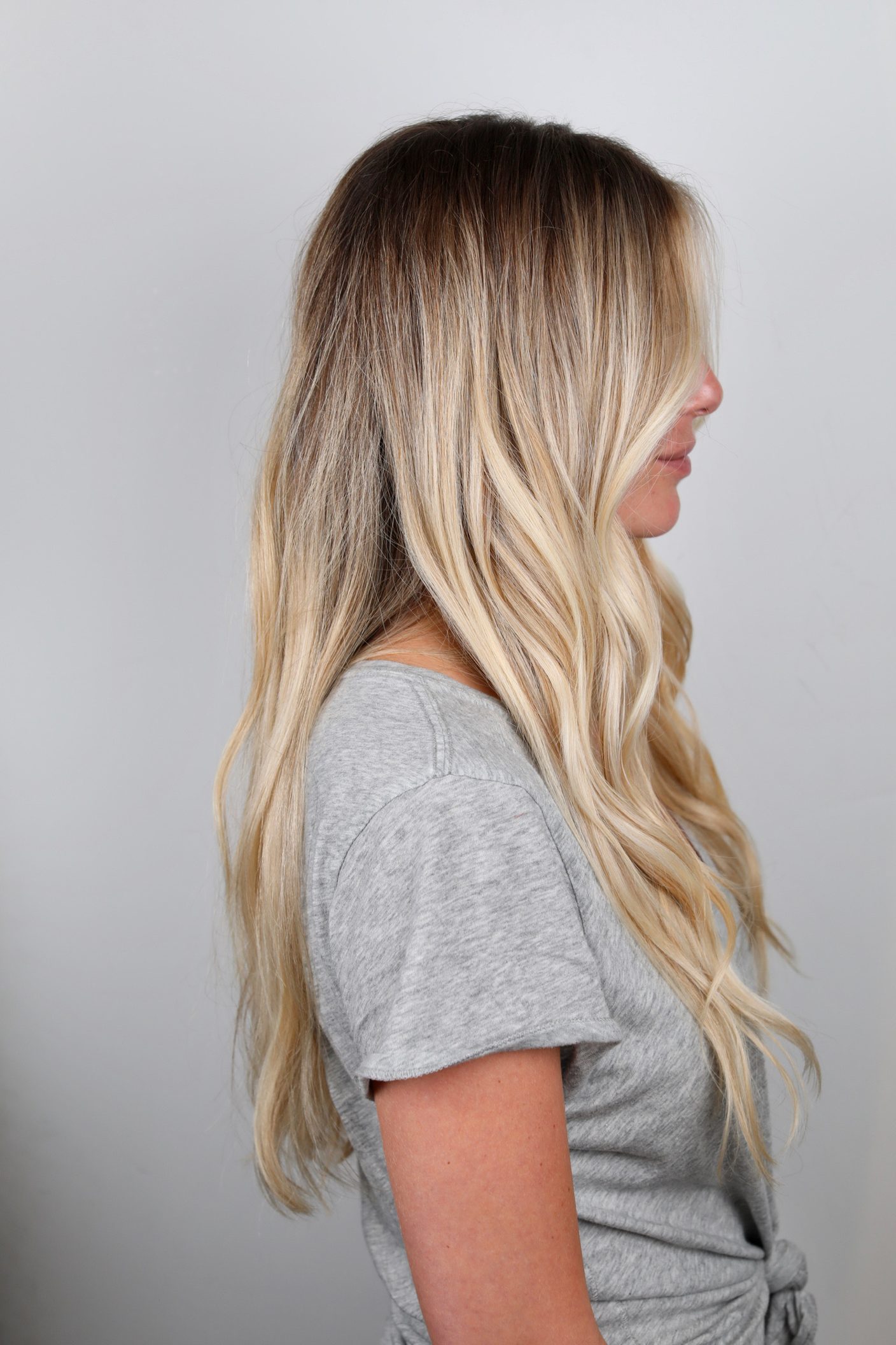 Lived-in color by Johnny Ramirez — soft, sun-grown blonde, dark at the root and bright at the ends.