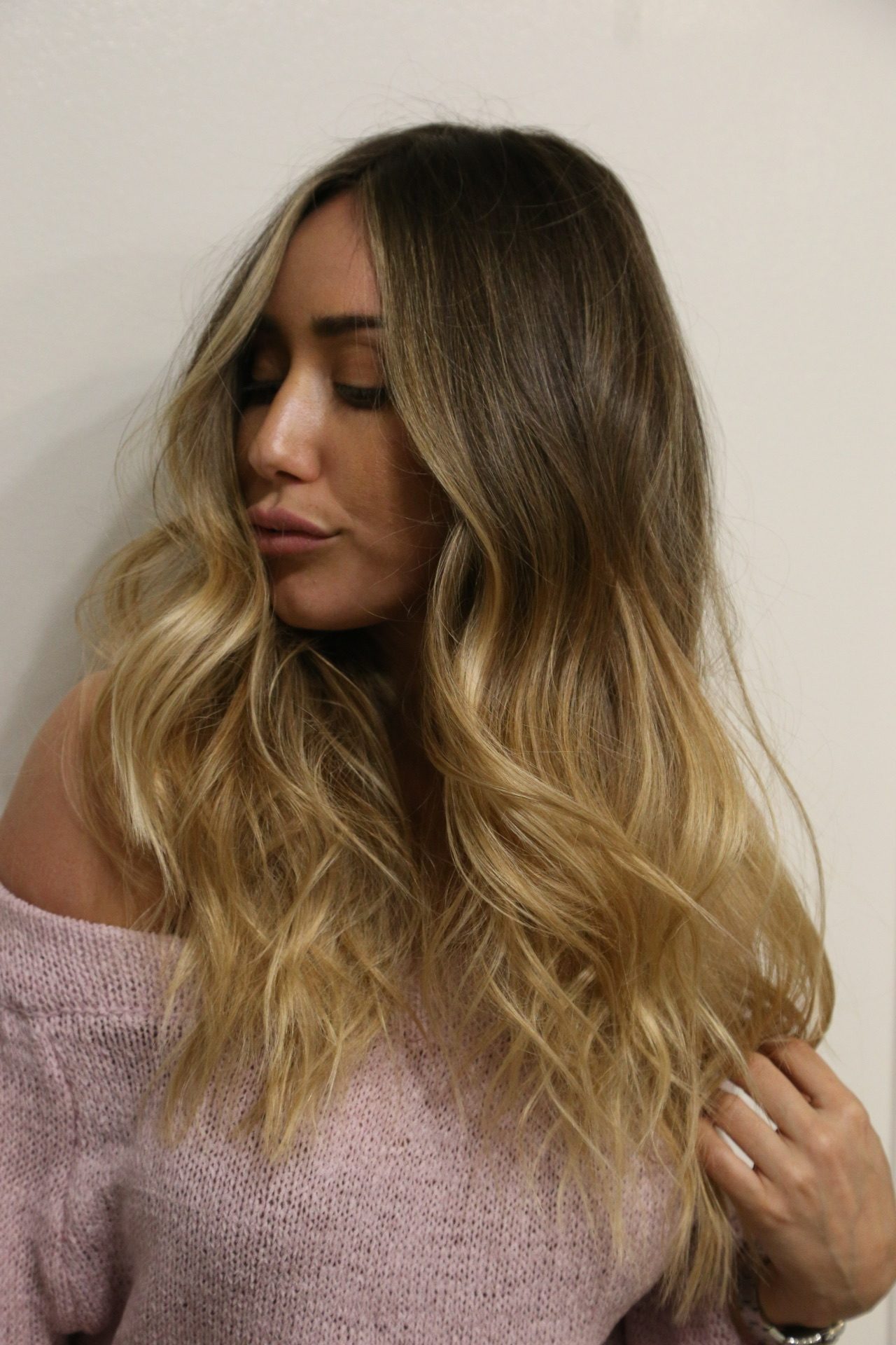 Soft, graduated color: deeper at the root, blending to blonde through the lengths.